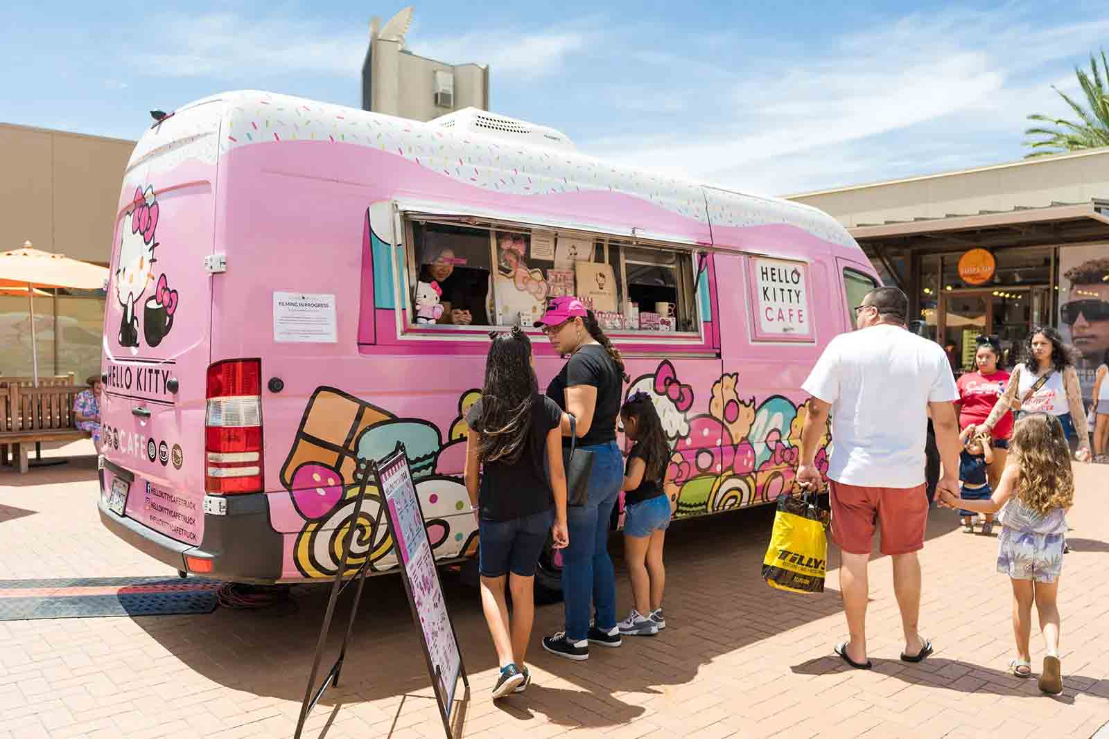 The C'est La Vie Cafe mobile beverage van serving guests at an event
